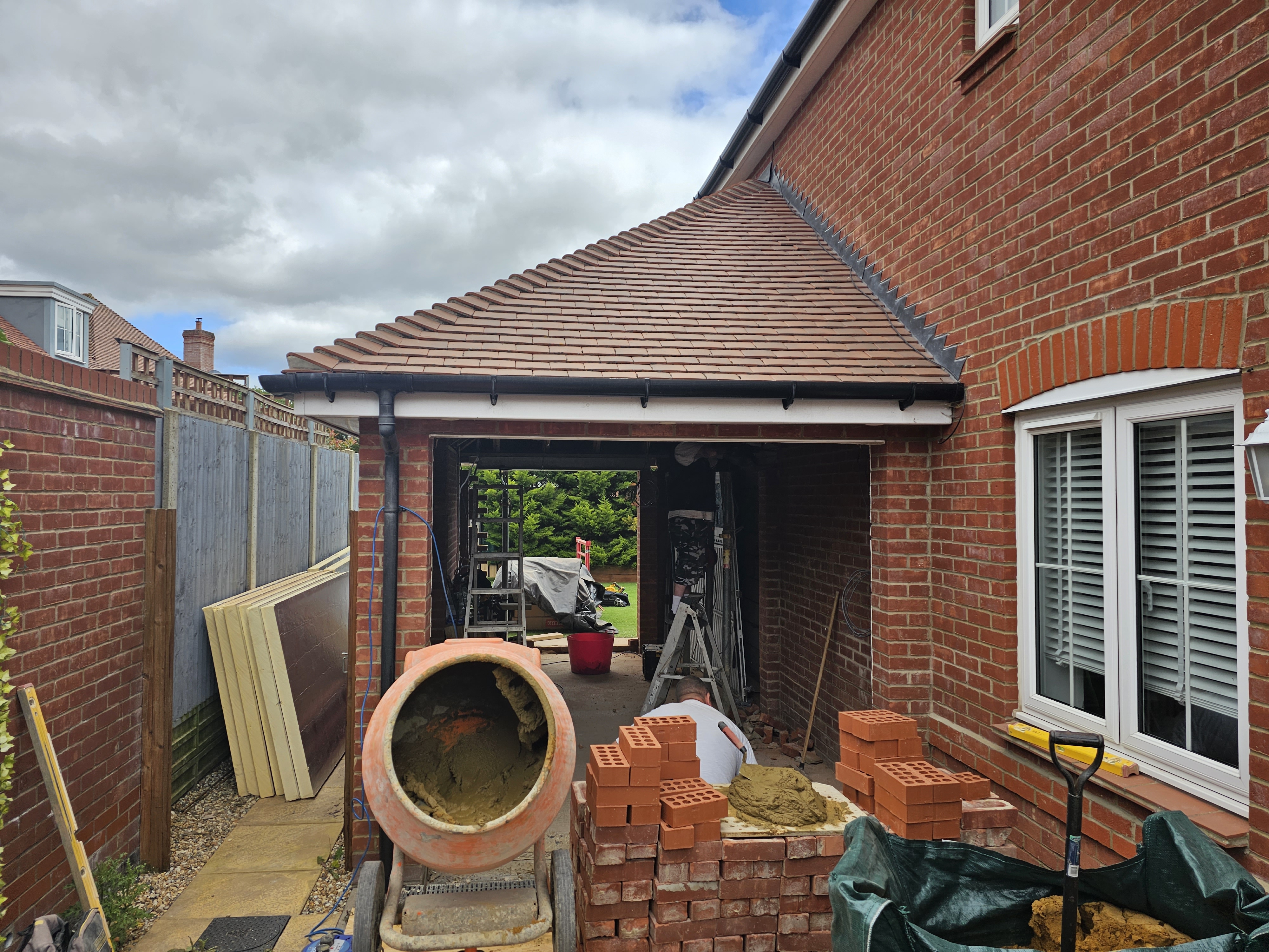 Garage conversion in progress — structural work at Huxley Close