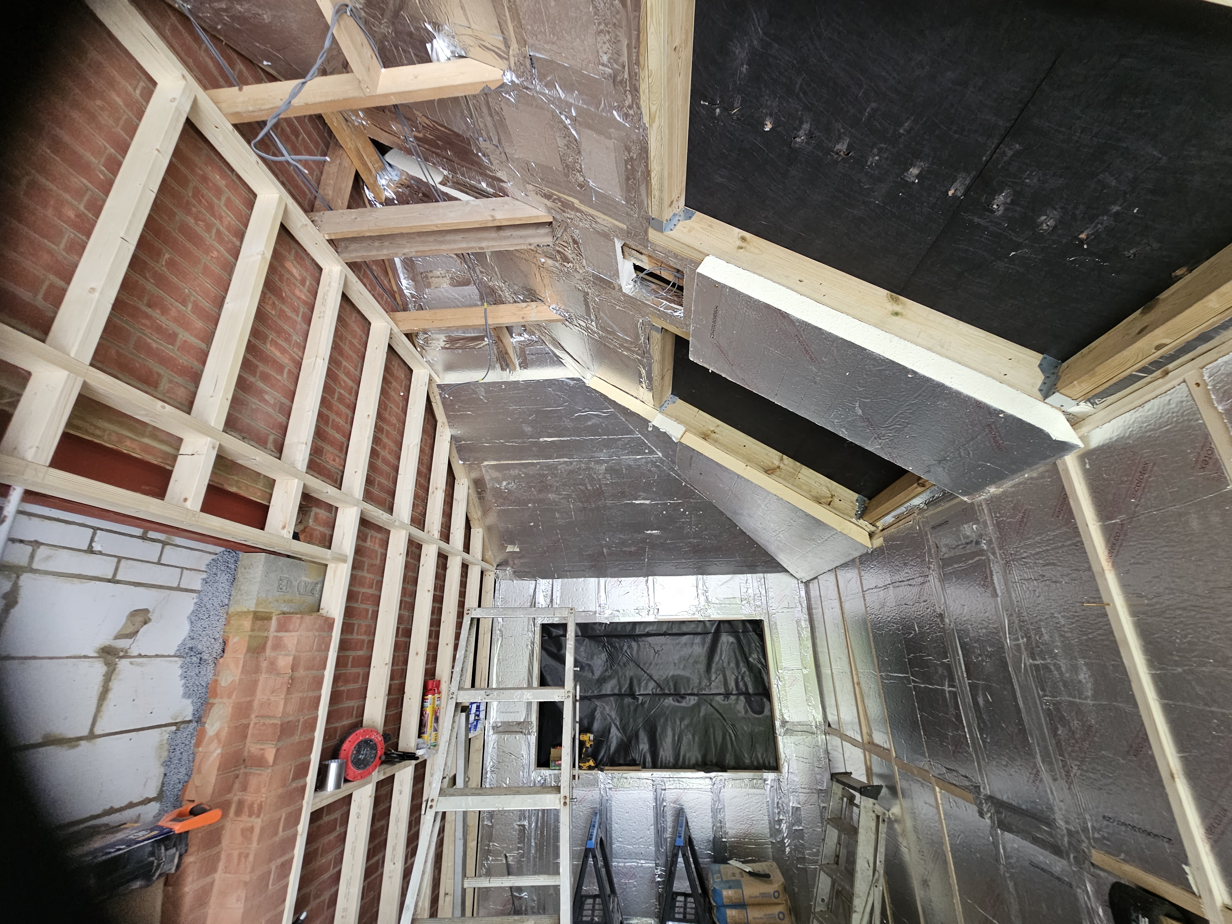 Roof insulation and timber work during the Huxley Close garage conversion