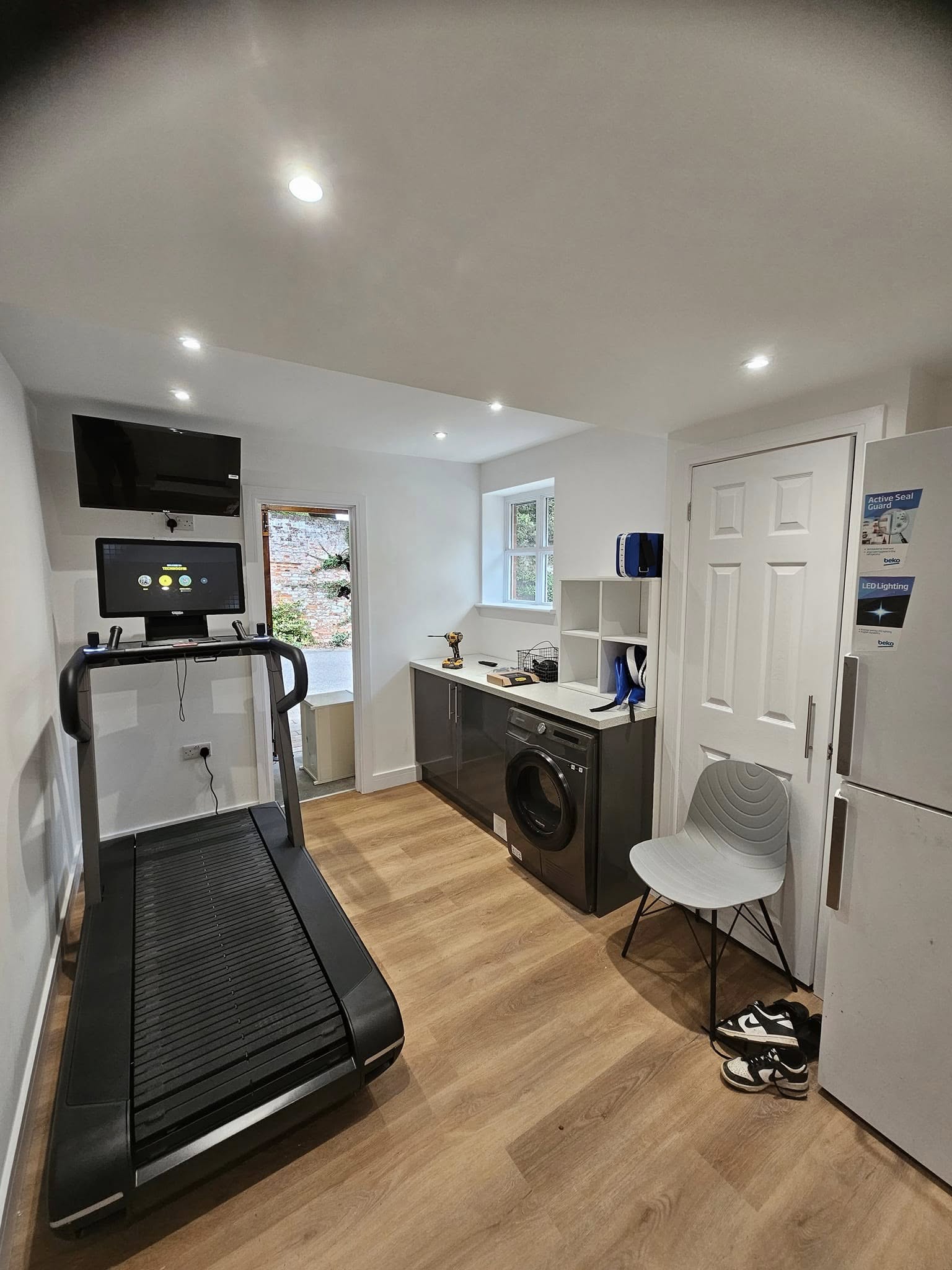 Completed Hertfordshire garage conversion used as a gym and utility room