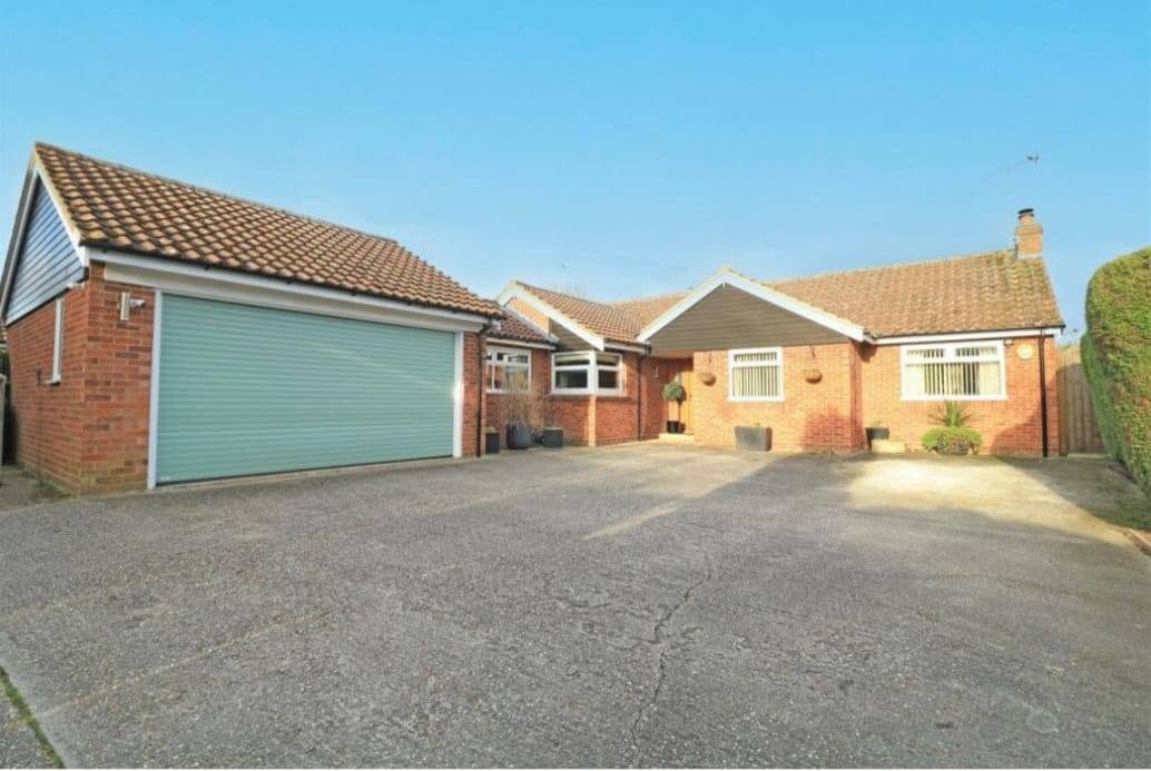 Double garage before conversion — exterior with green roller door, Chelmsford, Essex
