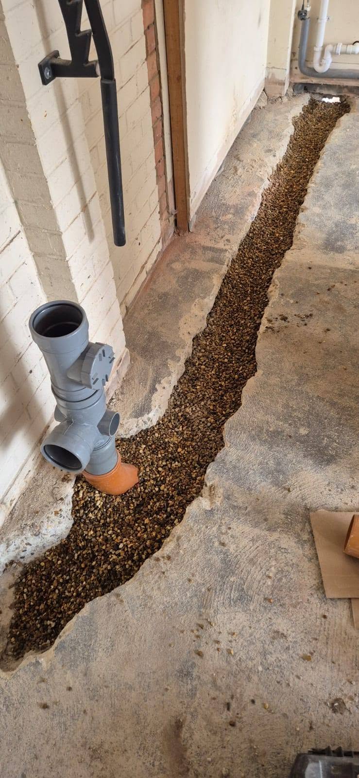 Foul drainage trench installed through a garage floor for a new bathroom in Chelmsford