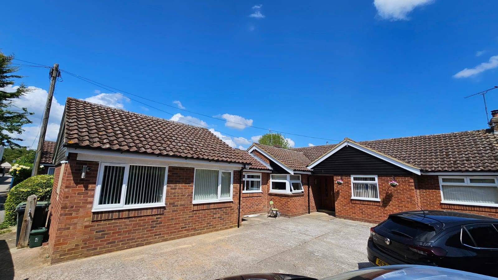Completed exterior of a detached double garage conversion project