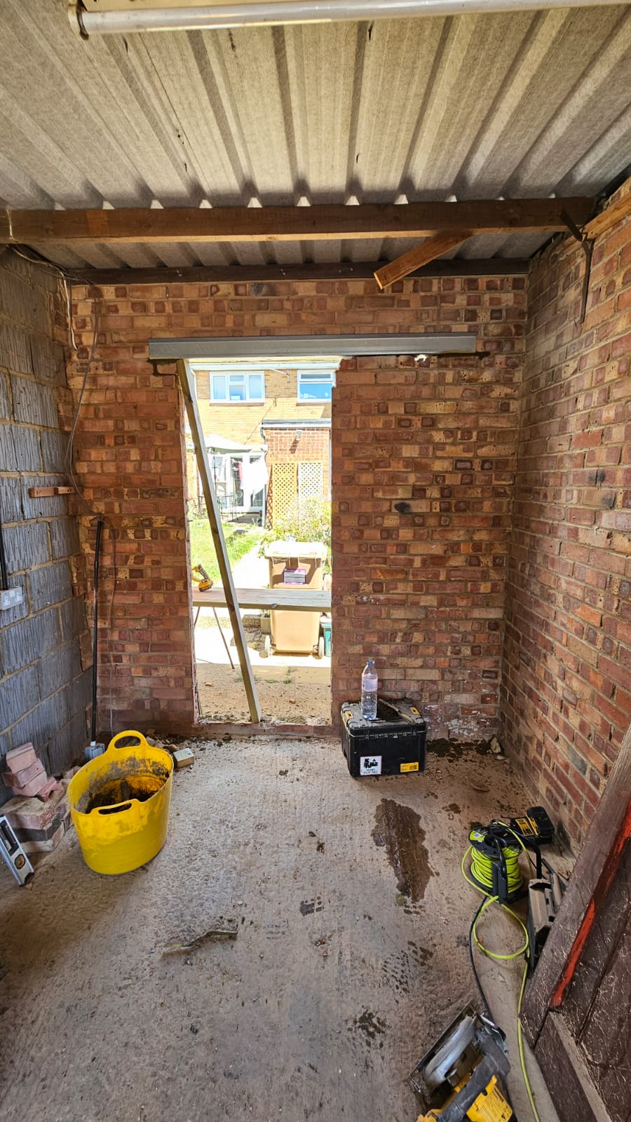 Original unlined rear garage space before partial conversion in Chelmsford