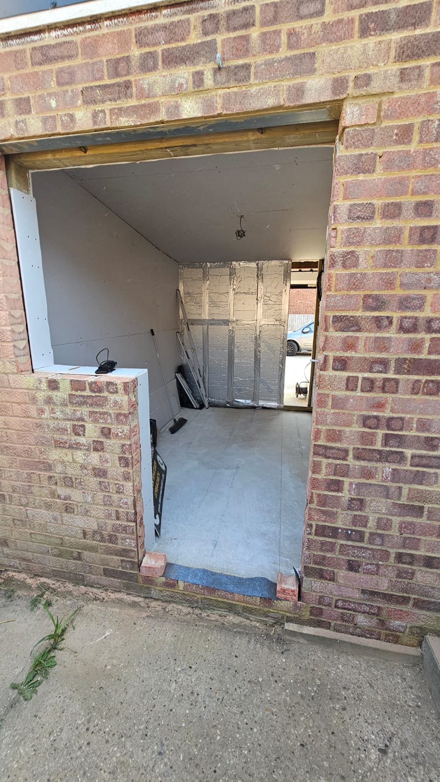 Enlarged rear opening and surrounding masonry during a partial garage conversion in Chelmsford
