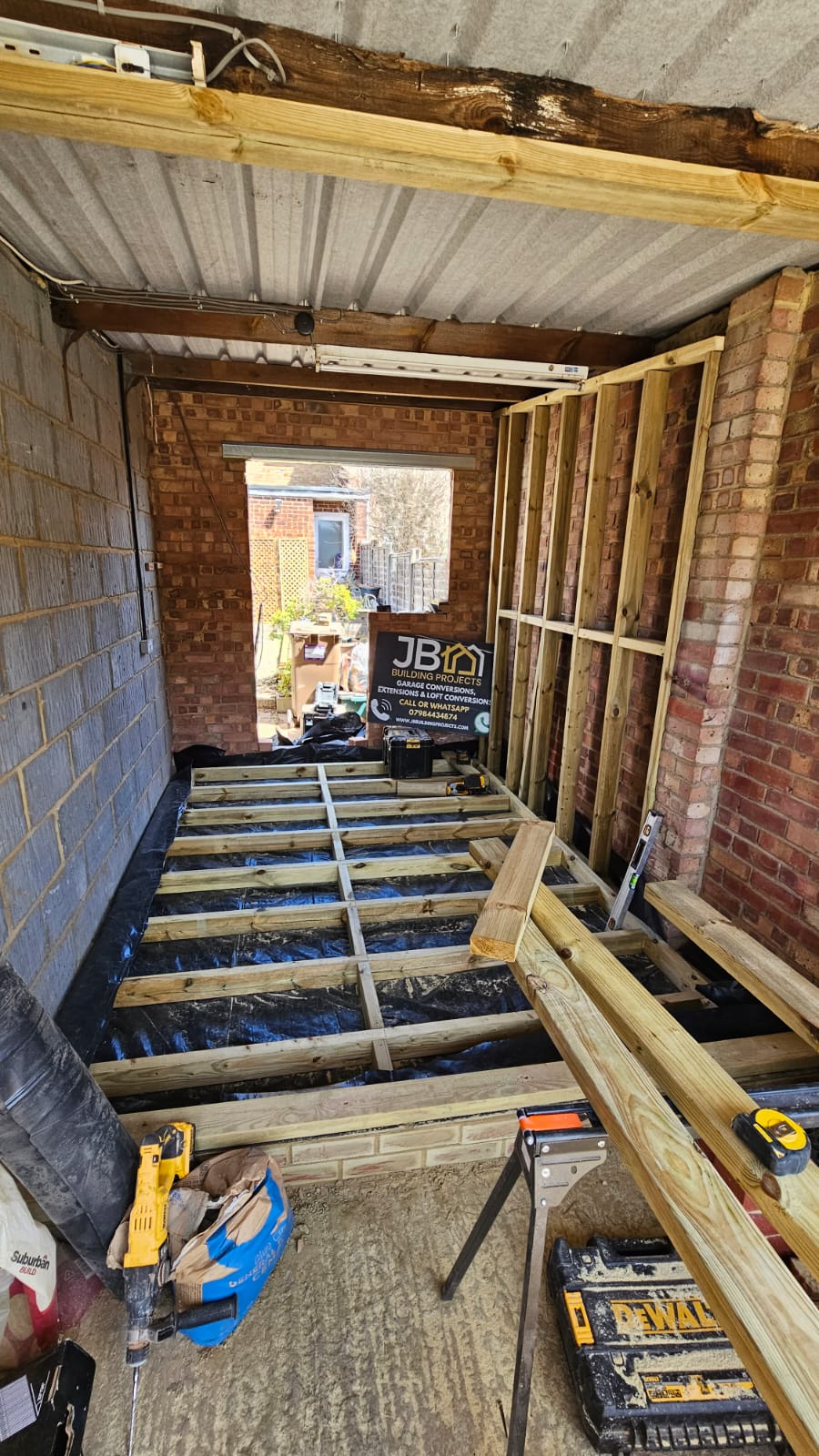 Timber floor and wall framing during a partial garage conversion in Chelmsford