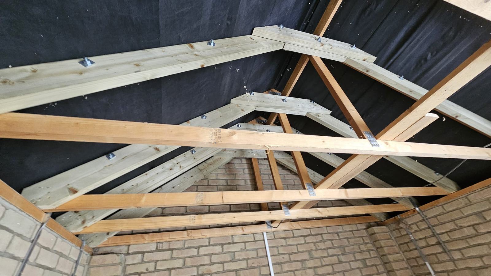 Overview of the bolted roof timber members during alterations to the Dunmow garage roof