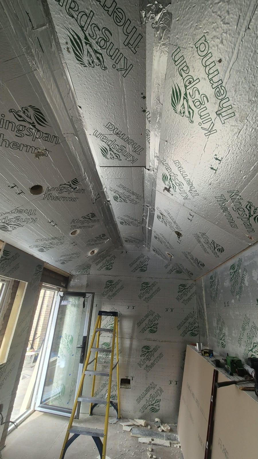 Dunmow office walls and pitched ceiling lined with foil-faced insulation before plasterboard and skim
