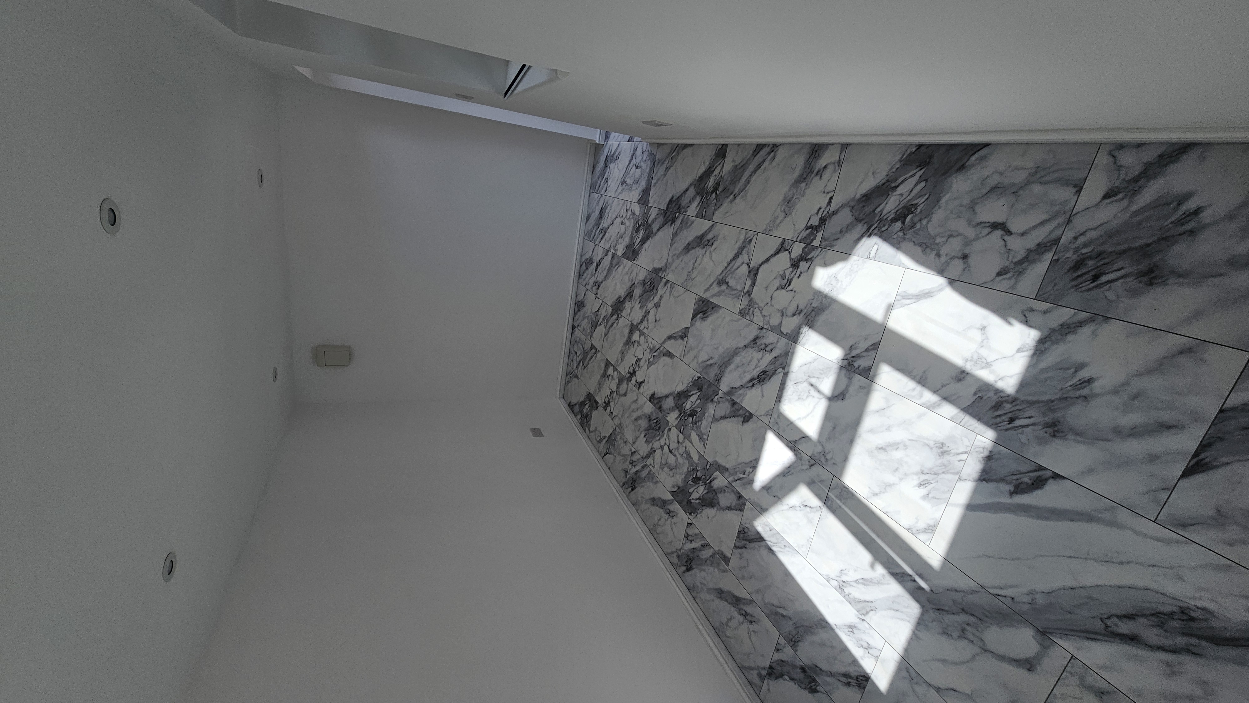 Reverse view of the completed Hatfield garage office and marble-effect flooring