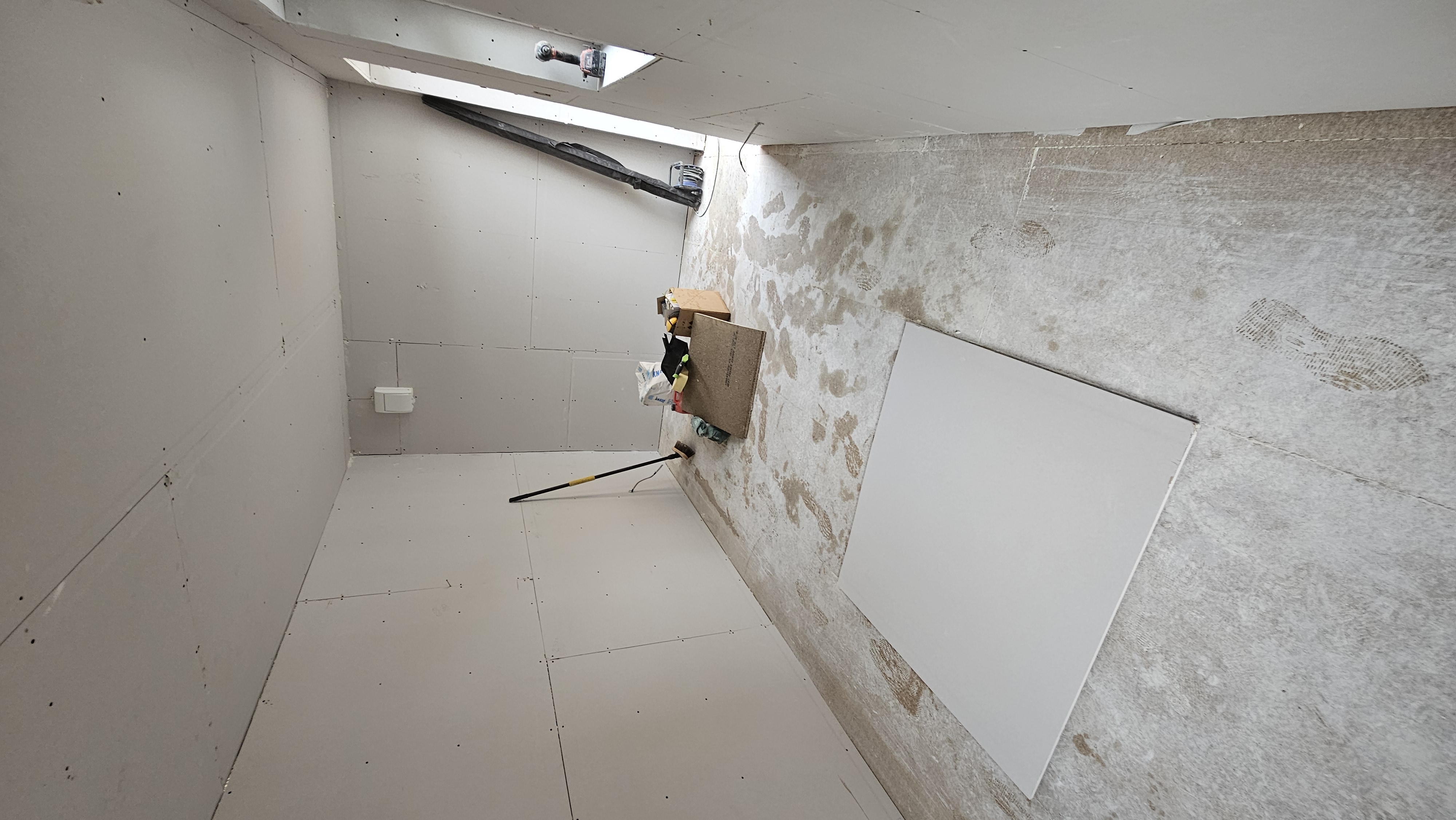Walls and ceiling lined with plasterboard during the Hatfield garage conversion
