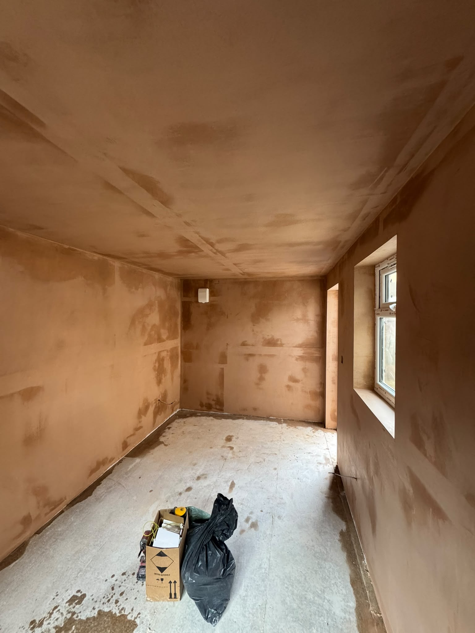 Freshly skimmed walls and ceiling inside the detached garage office