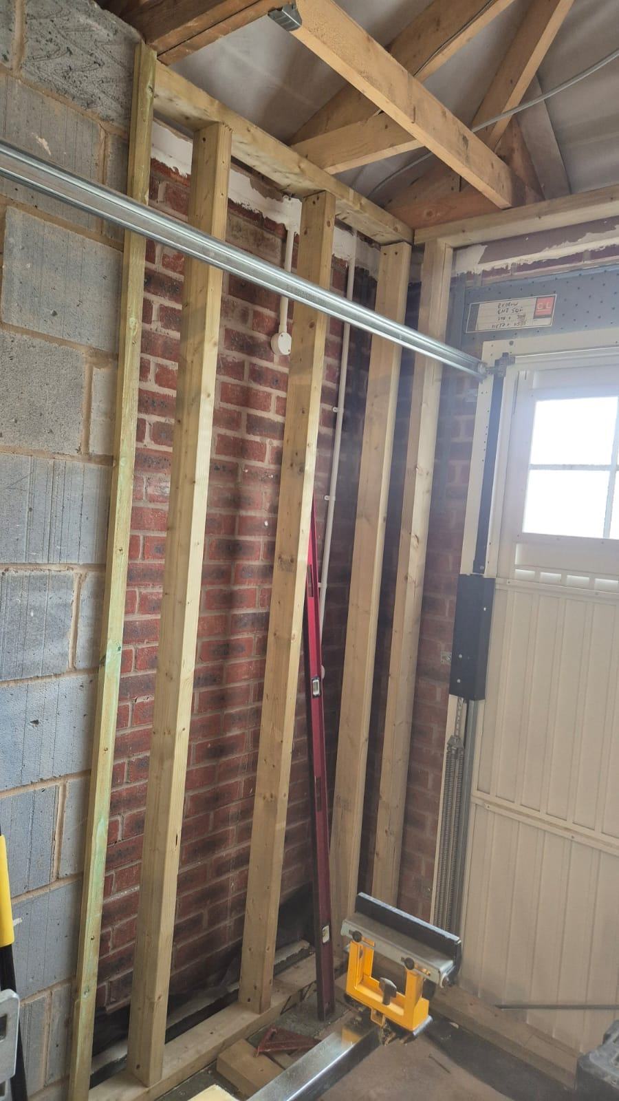 Exposed ceiling timbers and new timber wall linings inside the Waltham Cross office conversion