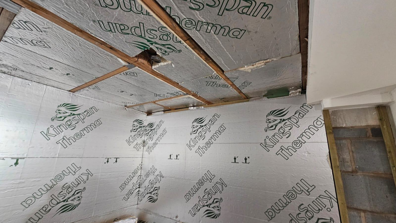 Foil-faced insulation fitted to the garage ceiling before the office plasterboard linings