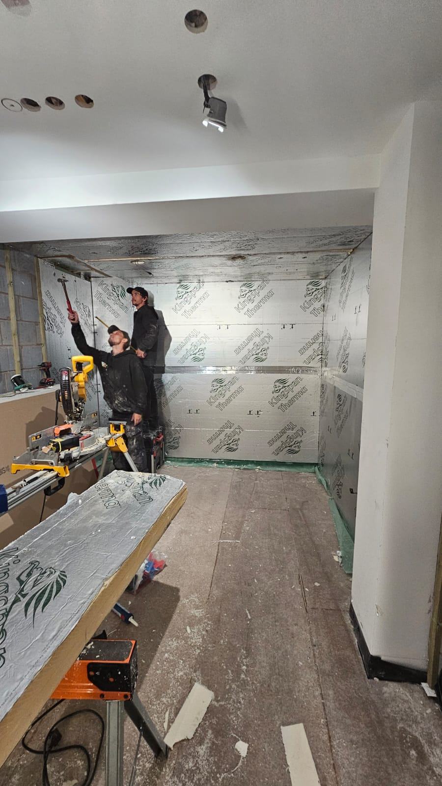 Foil-faced wall insulation and ceiling plasterboard visible during the Waltham Cross office conversion